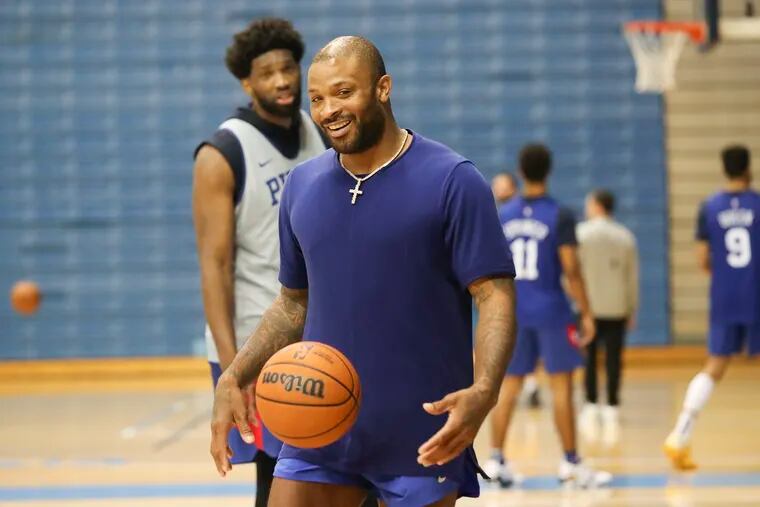 Joel Embiid has a conversation with P.J. Tucker after practice on the second day of Sixers training camp at the McAlister Field House on the campus of The Citadel in Charleston, SC on Wednesday, Sept. 28, 2022.
