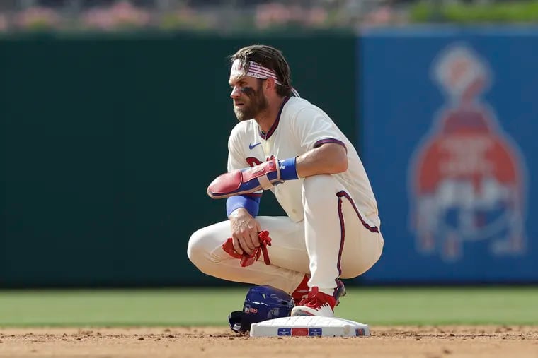 Bryce Harper rests at second base during a break in the action against the Miami Marlins in Game 1 of a doubleheader on July 16,.