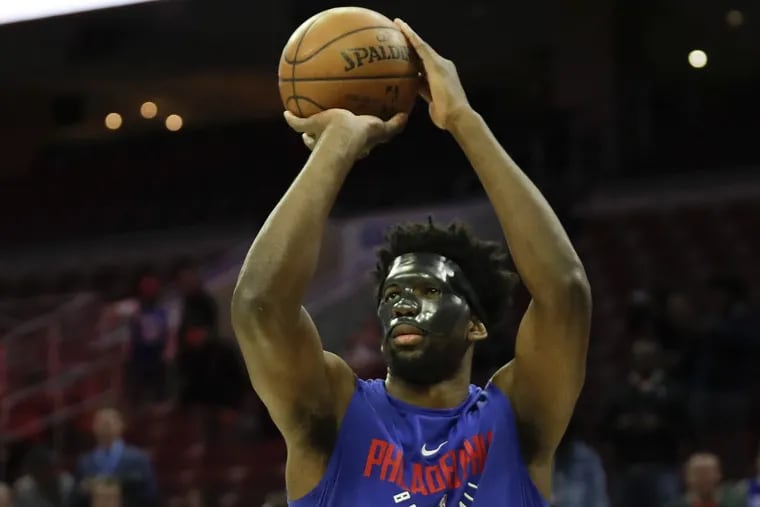 Joel Embiid wore a protective mask during warmups prior to the Sixers’ 130-95 win over the Milwaukee Bucks in the regular season finale.