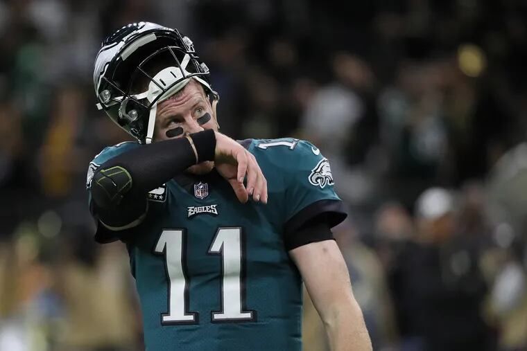 Carson Wentz watches the replay after his pass was intercepted late in the 4th quarter during the Eagles 48-7 loss to the New Orleans Saints on November 18, 2018.