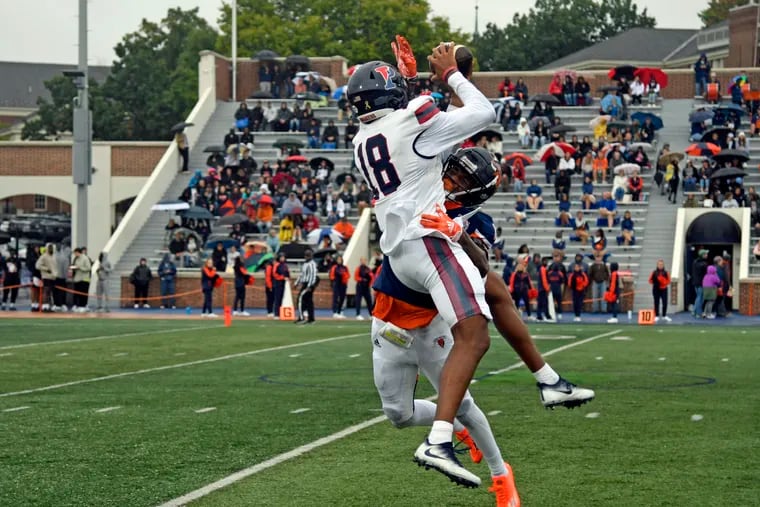 Penn's Jared Richardson (18) goes up for a ball in the Quakers' 37-21 win over Bucknell on Saturday.