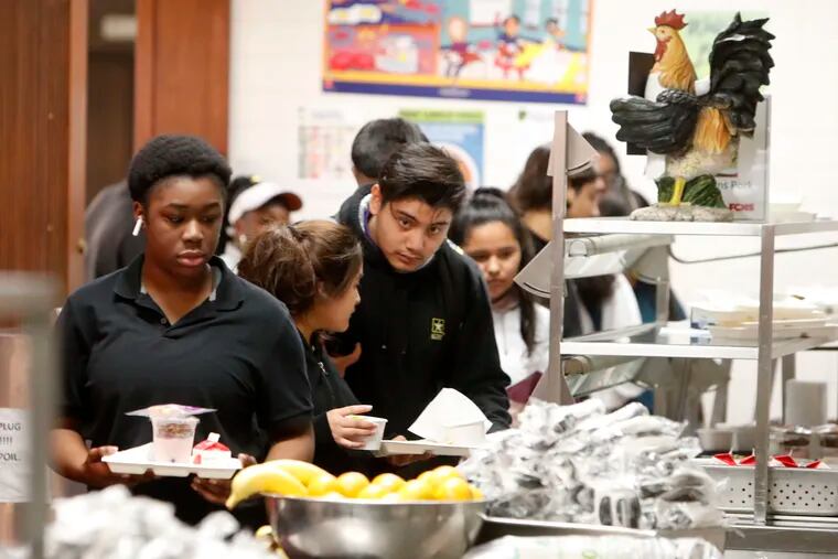 Students line up for lunch in the cafeteria at Lincoln High School in Dallas, Friday, March 13, 2020. During the coming extended spring break school closures, this cafeteria and others in the Dallas Independent School District will be providing lunches to students despite the closure of the school.