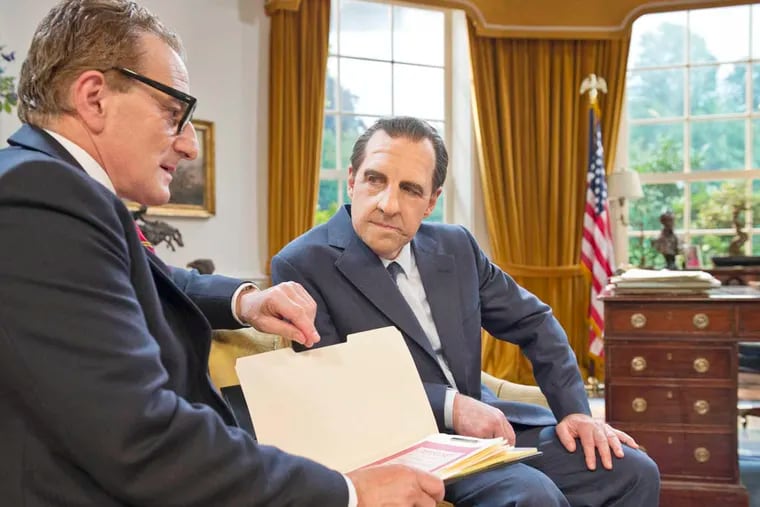 Henry Goodman as Henry Kissinger (with folder) and Harry Shearer as President Nixon. Photo: Justin Downing