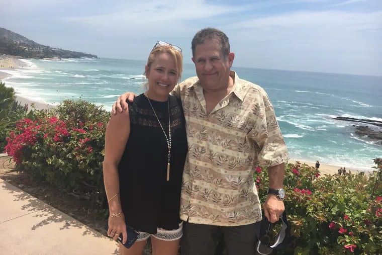 Christi Bernlohr and her biological father, Jeff, standing at Laguna Beach in southern Calif.