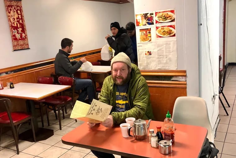 Bryan Dilworth about to feast on salt-baked chicken wings at Tasty Place on Jan. 14, 2020, a few days before the Chinatown favorite closed for good.