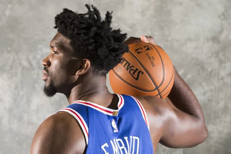 Sixers’ Joel Embiid strikes a pose at media day.