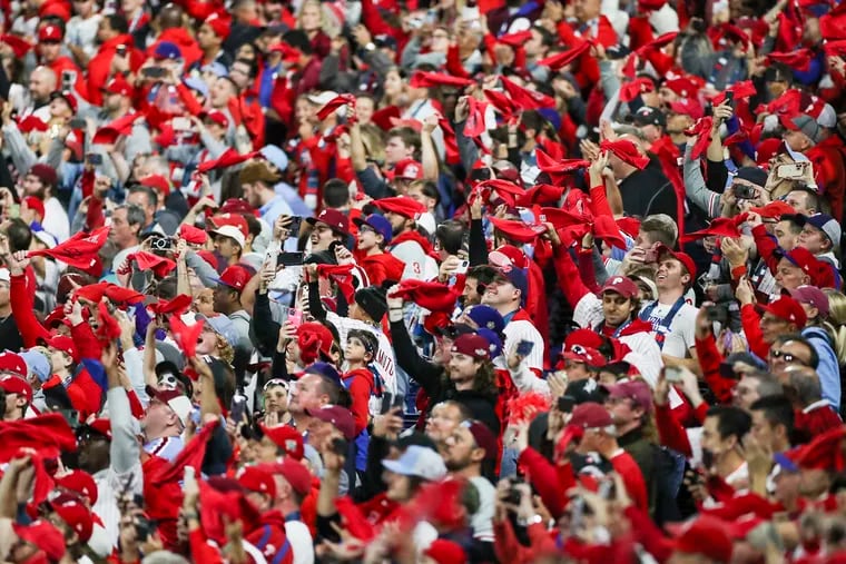 Philadelphia Phillies fans wave their rally towels during Game 3 of the World Series against the Houston Astros at Citizens Bank Park on Tuesday.