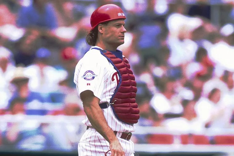 Philadelphia Phillies catcher Darren Daulton (10) ) sets for play in a Major League Baseball game in 1994.