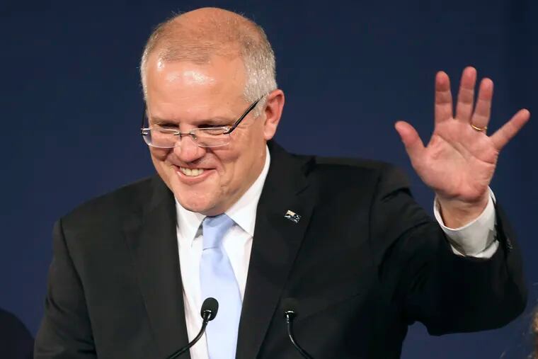 Australian Prime Minister Scott Morrison speaks to party supporters after his opponent concedes defeat in the federal election in Sydney, Australia, Sunday, May 19, 2019. Australia's ruling conservative coalition, lead by Morrison, won a surprise victory in the country's general election, defying opinion polls that had tipped the center-left opposition party to oust it from power and promising an end to the revolving door of national leaders. (AP Photo/Rick Rycroft)
