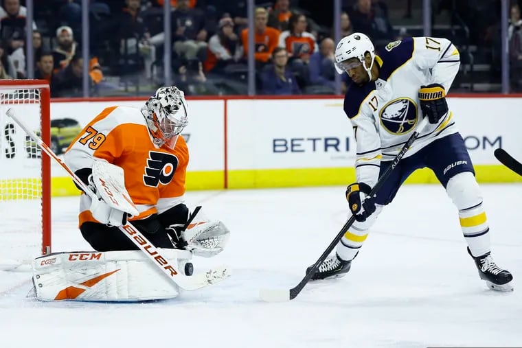 Flyers goalie Carter Hart blocks a shot from Buffalo's Wayne Simmonds (17) in a game late last season. Simmonds, a former Flyer, signed with Toronto on Friday, the first day of free agency.
