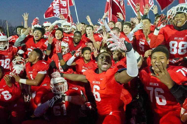 Delsea football players celebrate their victory over Camden in Saturday's Group 3 game at Rowan University.