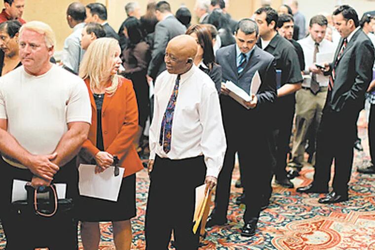 Job seekers line up at a career fair in Long Beach, Calif., a state where the unemployment rate hit 11.2 percent in March, third worst in the nation. Pennsylvania’s rate rose to 7.8 percent in March. (RICHARD VOGEL / Associated Press)