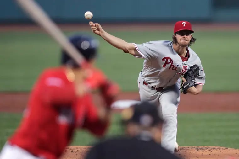 Phillies starting pitcher Aaron Nola delivers during the first inning of a 3-2 win Tuesday against Boston.