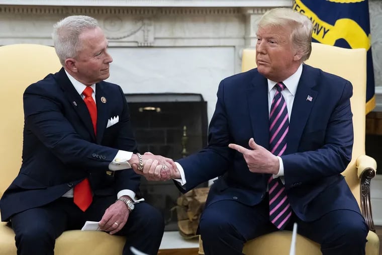 U.S. President Donald J. Trump, right, shakes hands with U.S. Rep. Jeff Van Drew, left, of New Jersey the day after the U.S. House of Representatives impeached Trump, on Thursday, Dec. 19, 2019 in the Oval Office of the White House in Washington, D.C. Van Drew of New Jersey was one of three Democrats that crossed party lines to oppose one or both of the impeachment articles passed in the House of Representatives. Van Drew has said he will switch to the Republican party. (Abaca Press/Pool/TNS)