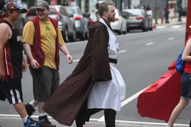 Obi-Wan Kenobi crosses Arch Street heading toward Wizard World at the Convention Center on Sunday.
