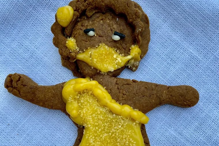 Gingerbread people with curly hair and masks add a social and cultural sensibility.