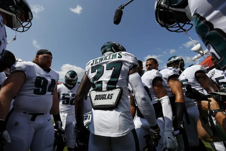 Philadelphia Eagles strong safety Malcolm Jenkins (27) leads teammates in a huddle before an NFL football game against the Washington Redskins, Sunday, Sept. 10, 2017, in Landover, Md. (AP Photo/Alex Brandon)