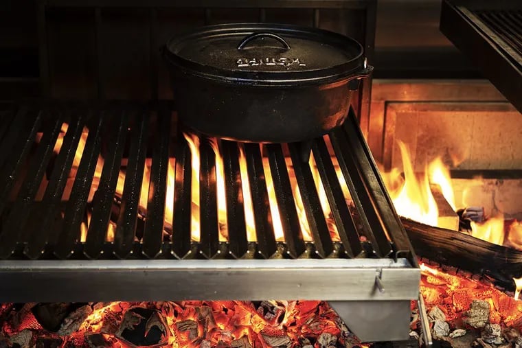 Cooking is done over a wood-burning grill at Ember & Ash.