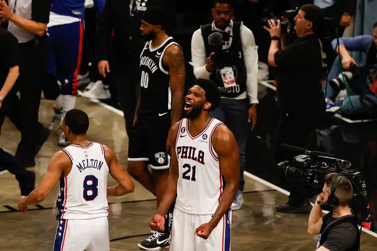 Sixers center Joel Embiid reacts with guard De'Anthony Melton after the Sixers beat the Brooklyn Nets in Game 3.