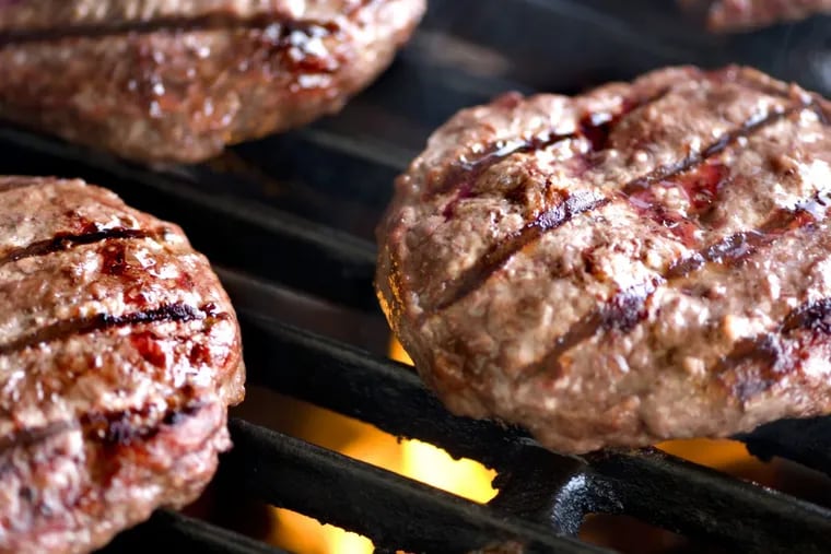 Wal-Mart is upgrading its burgers to Angus beef at no additional cost to combat new low-cost stores like Aldi and Lidl.