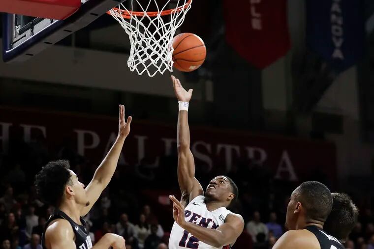 Penn guard Devon Goodman driving to the basket for a layup in the win over Harvard on Jan. 31.
