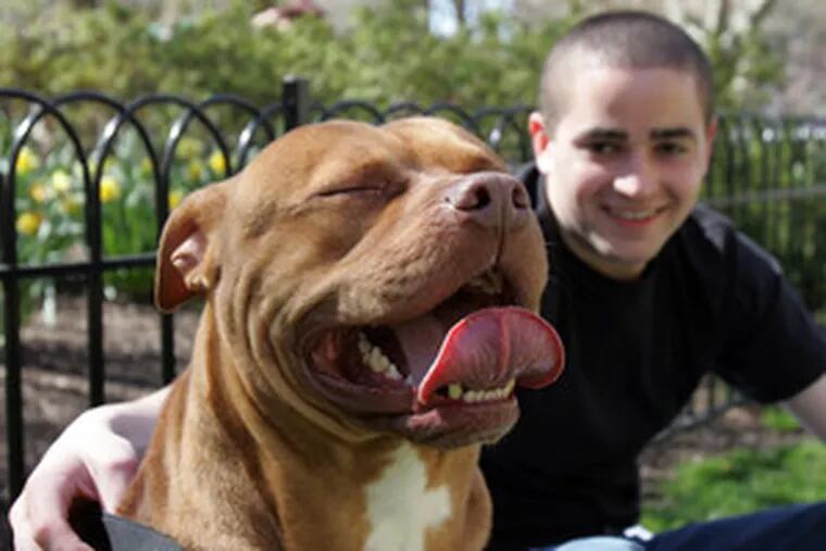 Kiko Galarza, 23, and his 2-year-old dog Ricardo enjoy the sunny day in Philadelphia.