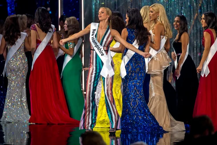 Miss New Hampshire Marisa Moorhouses dances as she and the other Miss America 2019 contestants leave the stage at the end of the first night of preliminaries in the 92nd Miss America competition in Boardwalk Hall in Atlantic City