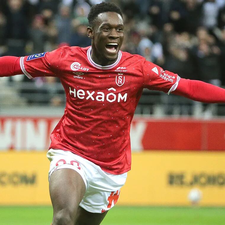 New U.S. striker Folarin Balogun hit the 20-goal mark in France's Ligue 1 with Reims.