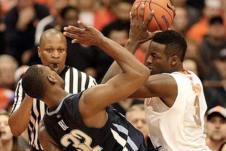 Syracuse’s Jerami Grant hits Villanova’s James Bell with his elbow. (Nick Lisi/AP)