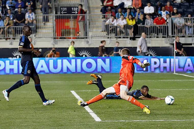 The Union's Bakary Soumaré, Zac MacMath and Raymon Gaddis  (from left to right) watch a shot by Los Angeles' Hector Jimenez head into the net. (Yong Kim/Staff Photographer)