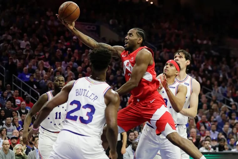 Toronto Raptors forward Kawhi Leonard drives to the basket against the Sixers defense during game six in the Eastern Conference playoff semifinals on Thursday, May 9, 2019 in Philadelphia.
