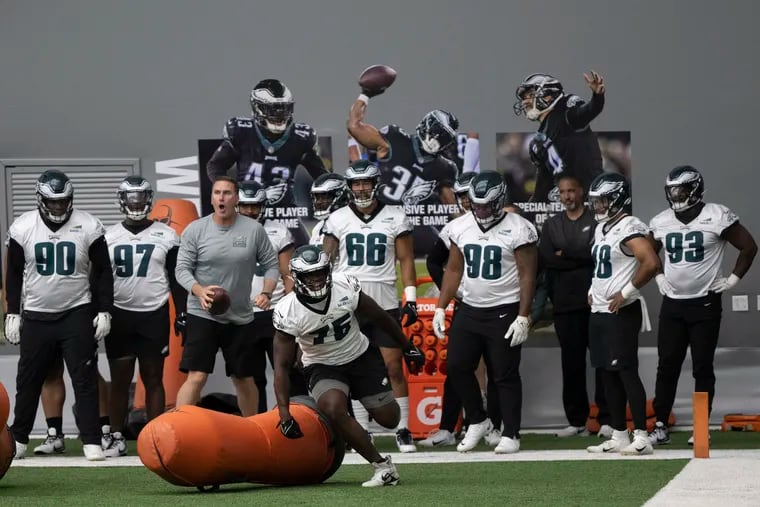 Eagles players practice indoors Thursday at the NovaCare Complex.