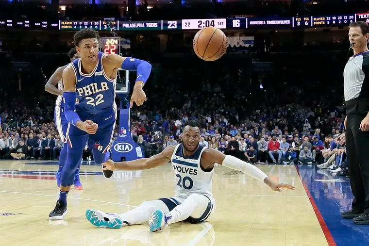 The Sixers' Matisse Thybulle chases after a loose ball past the  Timberwolves' Josh Okogie.