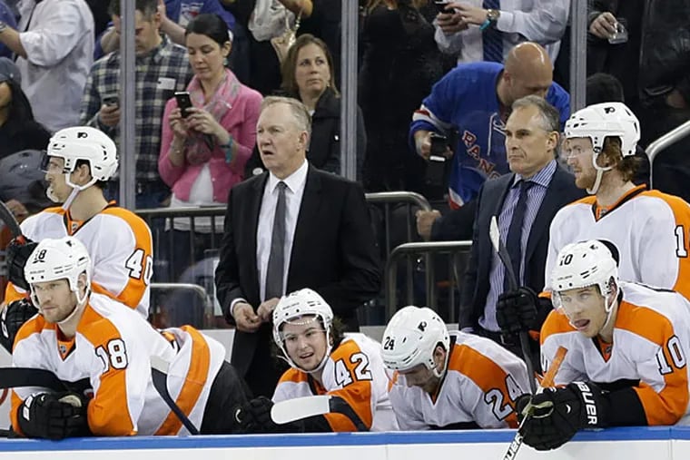 Brayden Schenn (10), Matt Read (24), Jason Akeson (42) and Adam Hall (18) watch during the third period in Game 7 of an NHL hockey first-round playoff series against the New York Rangers, Wednesday, April 30, 2014, in New York. The Rangers won the game 2-1. (AP Photo)