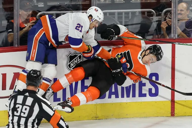 The Flyers' German Rubtsov (right) got the worst of a collision with the Islanders' Luca Sbisa during an exhibition game last season.
