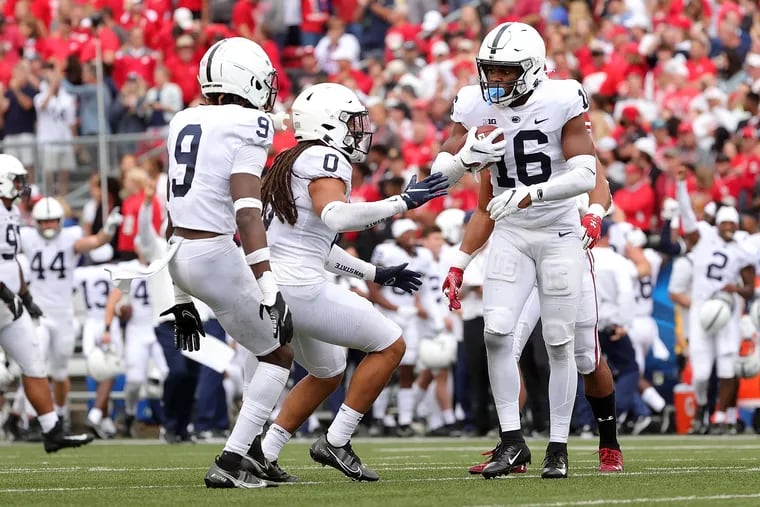 Penn State's Ji'Ayir Brown (16) celebrates after intercepting a pass to end the game against Wisconsin.