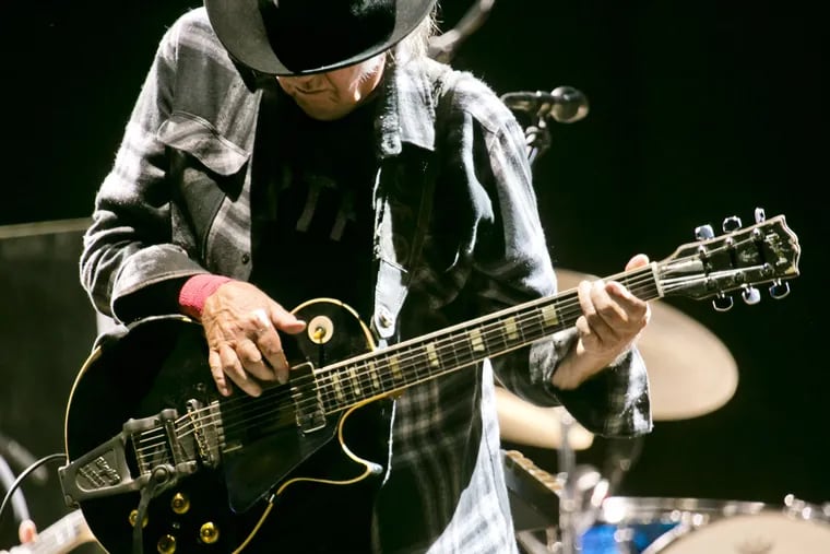 Neil Young performs at the Mad Cool Festival on June 18, 2016 in Madrid, Spain. Young will be auctioning off guitars, cars, model trains and other items for charity.