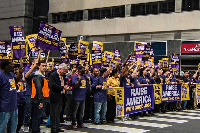 Members of 32BJ SEIU took to the streets for a rally that drew several Council members and mayoral hopeful Jim Kenney. (AARON WINDHORST/STAFF PHOTOGRAPHER)