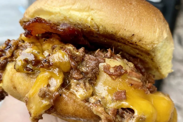 The Western from Sum Pig is smoked pork loin on a roll with Cheddar, thick-cut bacon, and barbecue sauce.