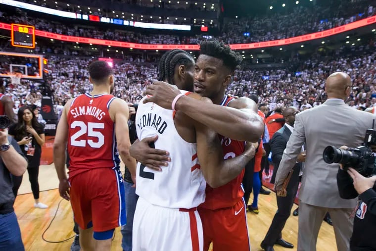 The Sixers' Jimmy Butler (right) is the target of sign-and-trade speculation by the Houston Rockets.