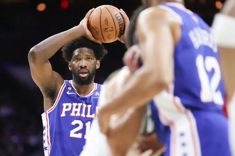 Sixers center Joel Embiid looks to pass the ball during a game against the Boston Celtics at the Wells Fargo Center in Philadelphia on Tuesday, April 4, 2023.
