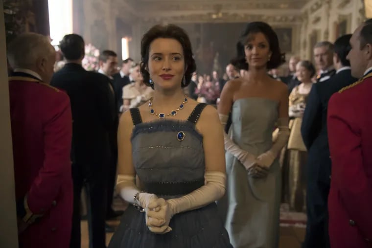 Claire Foy (left) as Queen Elizabeth and Jodi Balfour as Jackie Kennedy in a scene from the second season of Netflix's "The Crown." Both their gowns are part of "Costuming 'The Crown,'" an exhibition at Delaware's Winterthur Museum, Garden & Library that runs through Jan. 5, 2020.