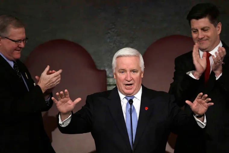 Gov. Corbett, joined by Speaker of the House Sam Smith (left) and Lt. Gov. Jim Cawley, draws applause at a joint session of the Pennsylvania House and Senate. Corbett offered a plan without spending cuts this time. MATT ROURKE / Associated Press