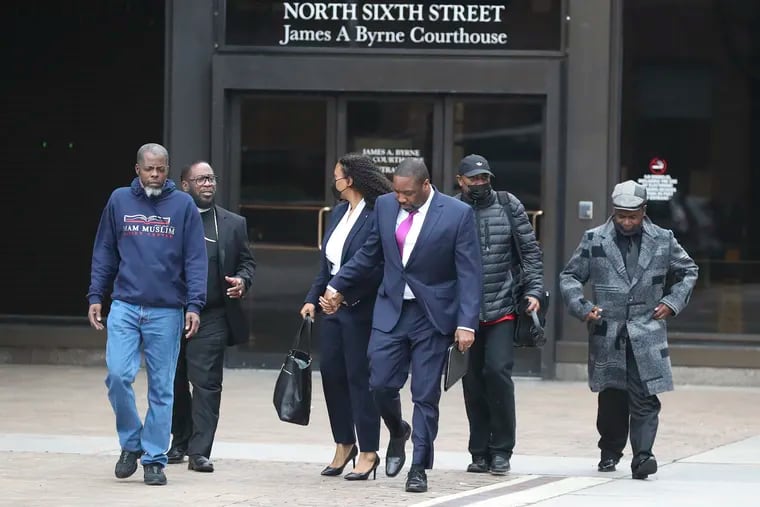 Philadelphia City Councilmember Kenyatta Johnson (center) and his wife Dawn Chavous leave the federal courthouse in Center City with supporters on March 24.
