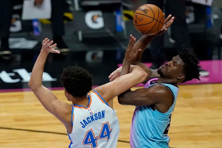 Jimmy Butler (right) is one eight Miami Heat players sidelined for the two-game series with the Sixers due to the NBA's COVID-19 health and safety protocols.