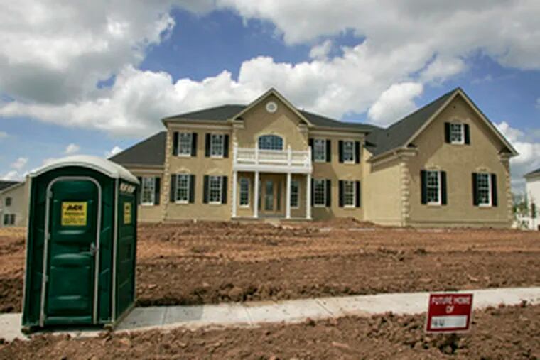An unfinished house ready for sale yesterday at a Toll Bros. development in Oaks, Pa. The Horsham homebuilder said that its second-quarter revenue dropped 19 percent.