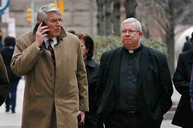 Msgr. William Lynn arrives at court with his attorney, Tom Berkstom.