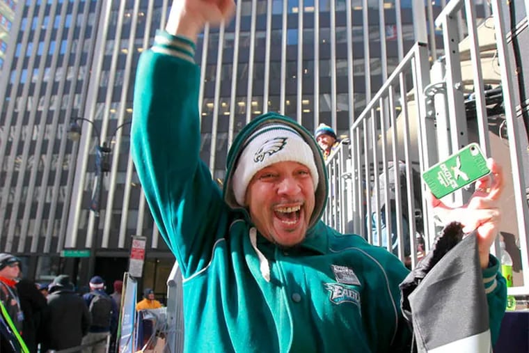 One happy Bird: Eagles fan Raymond Quarles of Mount Airy exults after wide receiver DeSean Jackson signed his Eagles bag at Times Square. (David Swanson / Staff Photographer)