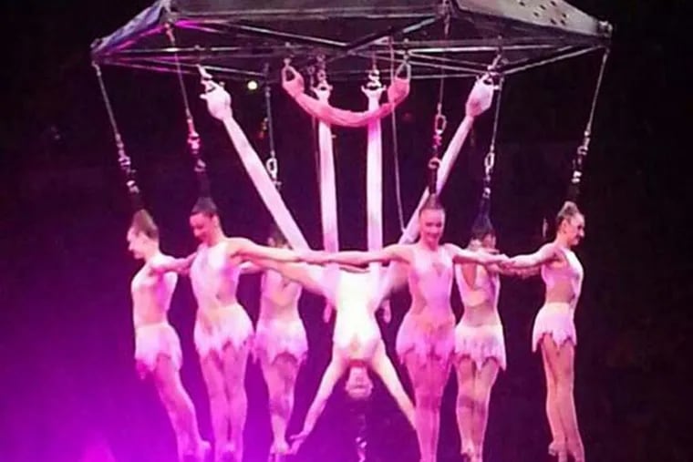 In this photo provided by Frank Caprio, performers hang during an aerial hair-hanging stunt at the Ringling Brothers and Barnum and Bailey Circus, Friday, May 2, 2104, in Providence, R.I. A platform collapsed during an aerial hair-hanging stunt at the 11 a.m. performance Sunday, May 4, sending eight acrobats plummeting to the ground. At least nine performers were seriously injured in the fall, including a dancer below, while an unknown number of others suffered minor injuries. (AP Photo/Frank Caprio) MANDATORY CREDIT