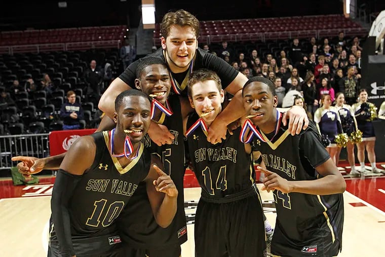 Sun Valley teammates (from left) Lance Stone, Marvin Freeman, Dominic Valente (top), Vinny DeAngelo and Isaac Kennon celebrate after the Vanguards won the District 1 Class 5A boys basketball championship game on Saturday, March 2, 2019 Sun Valley defeated West Chester East in the final, 65-54.